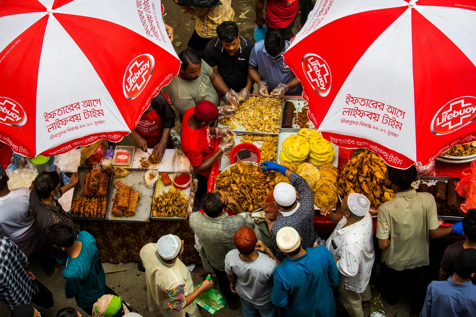 Street Food Stall with Many People Interested in Products