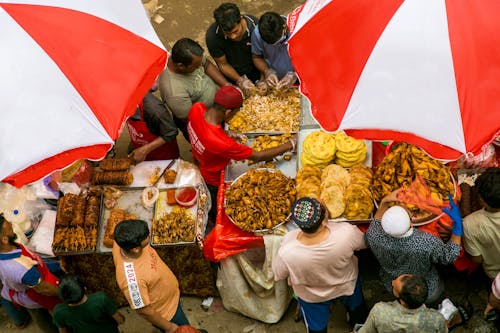 Free An overhead view of people eating food at a market Stock Photo