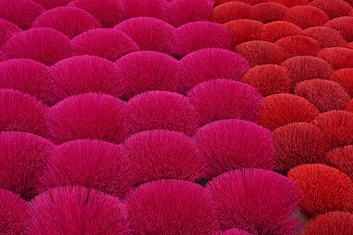 Free Bright red and pink incense sticks drying under the sun in Hanoi, Vietnam. Stock Photo