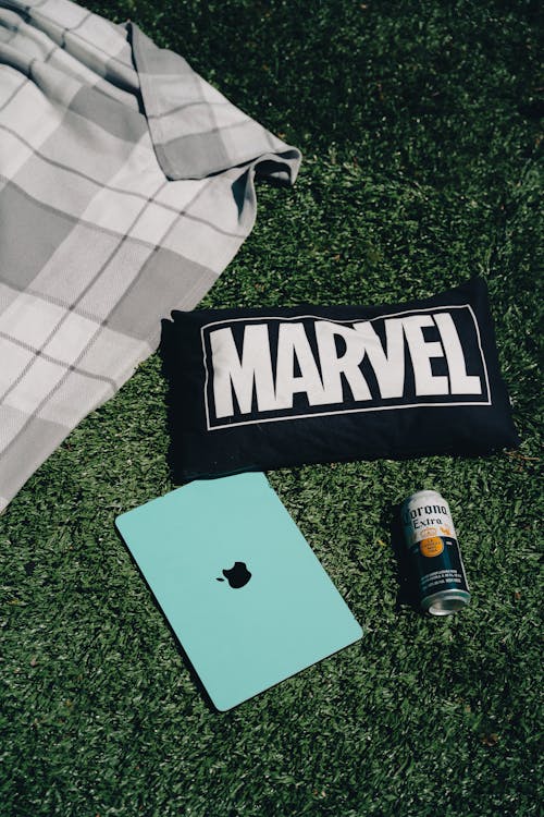 A tablet, a bag and a marvel pillow