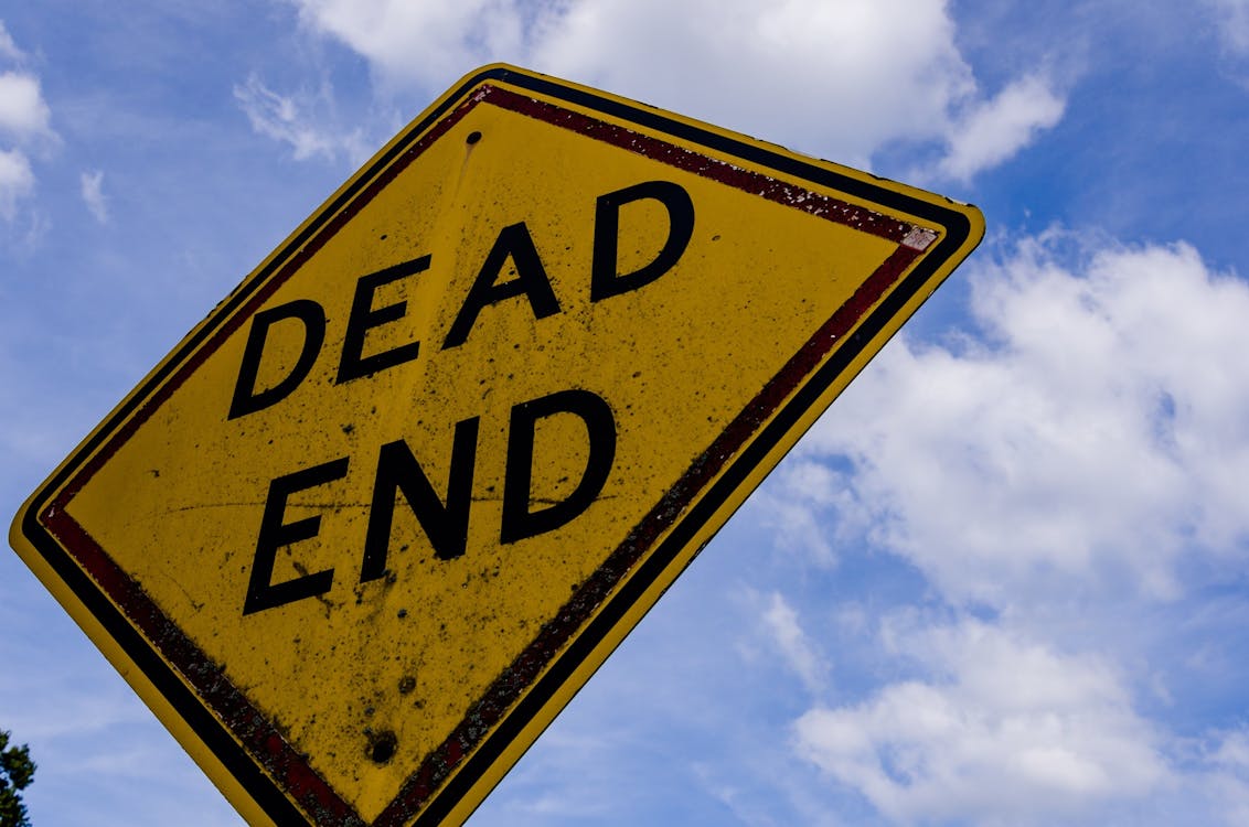 Dead End Road Sign With A Road Going To Horizon In The Background Stock  Photo - Download Image Now - iStock