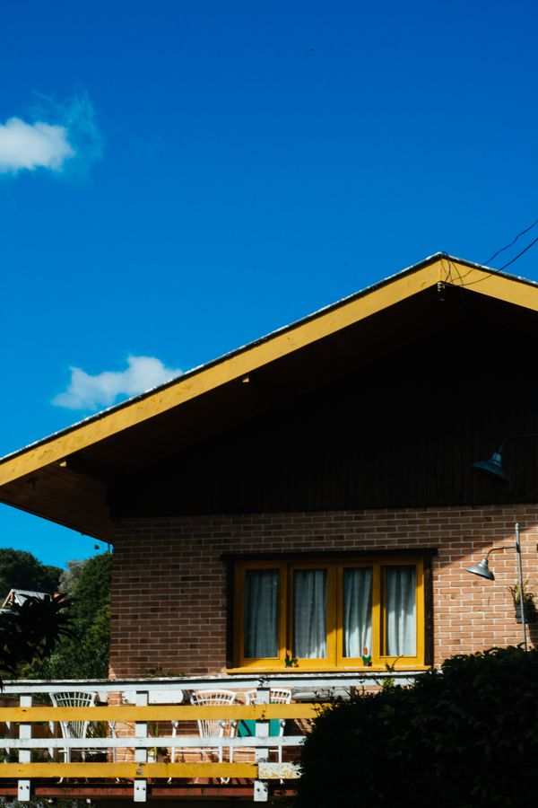 Brick home exterior under a clear blue sky