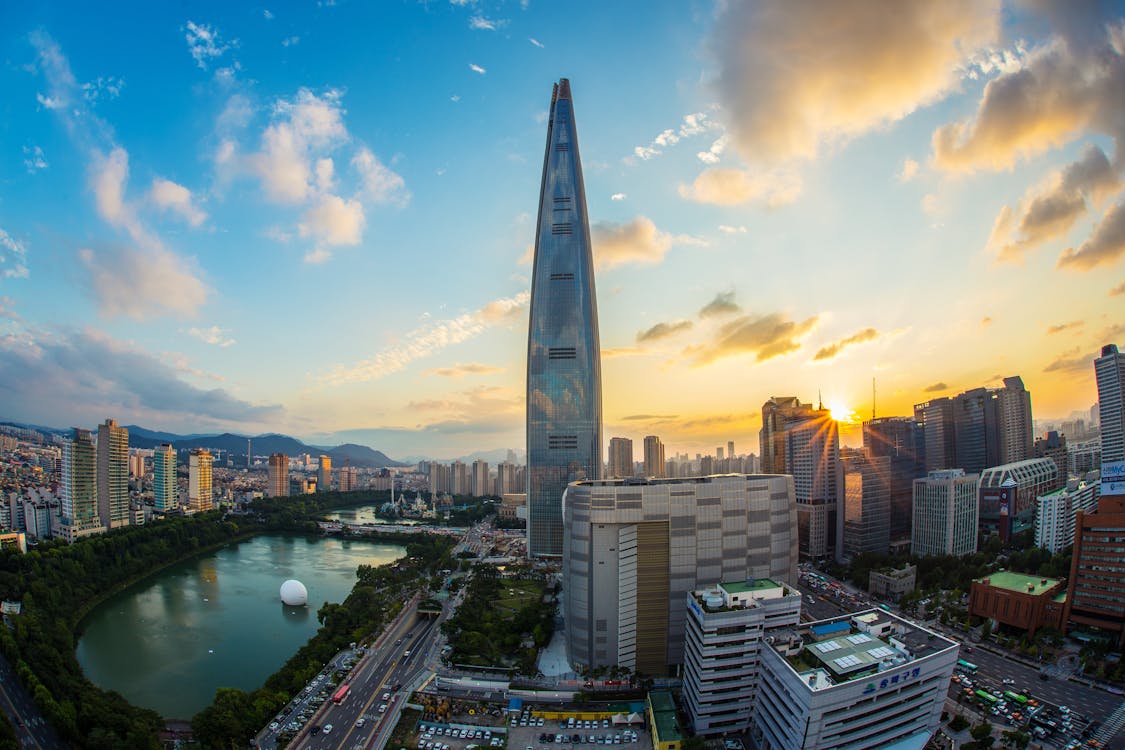 Free Buildings and Body of Water during Golden Hour Stock Photo