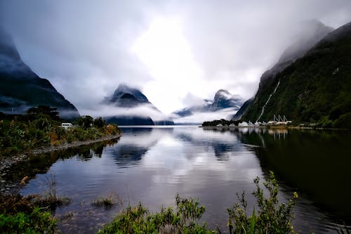 Body of Water Surrounded by Mountains