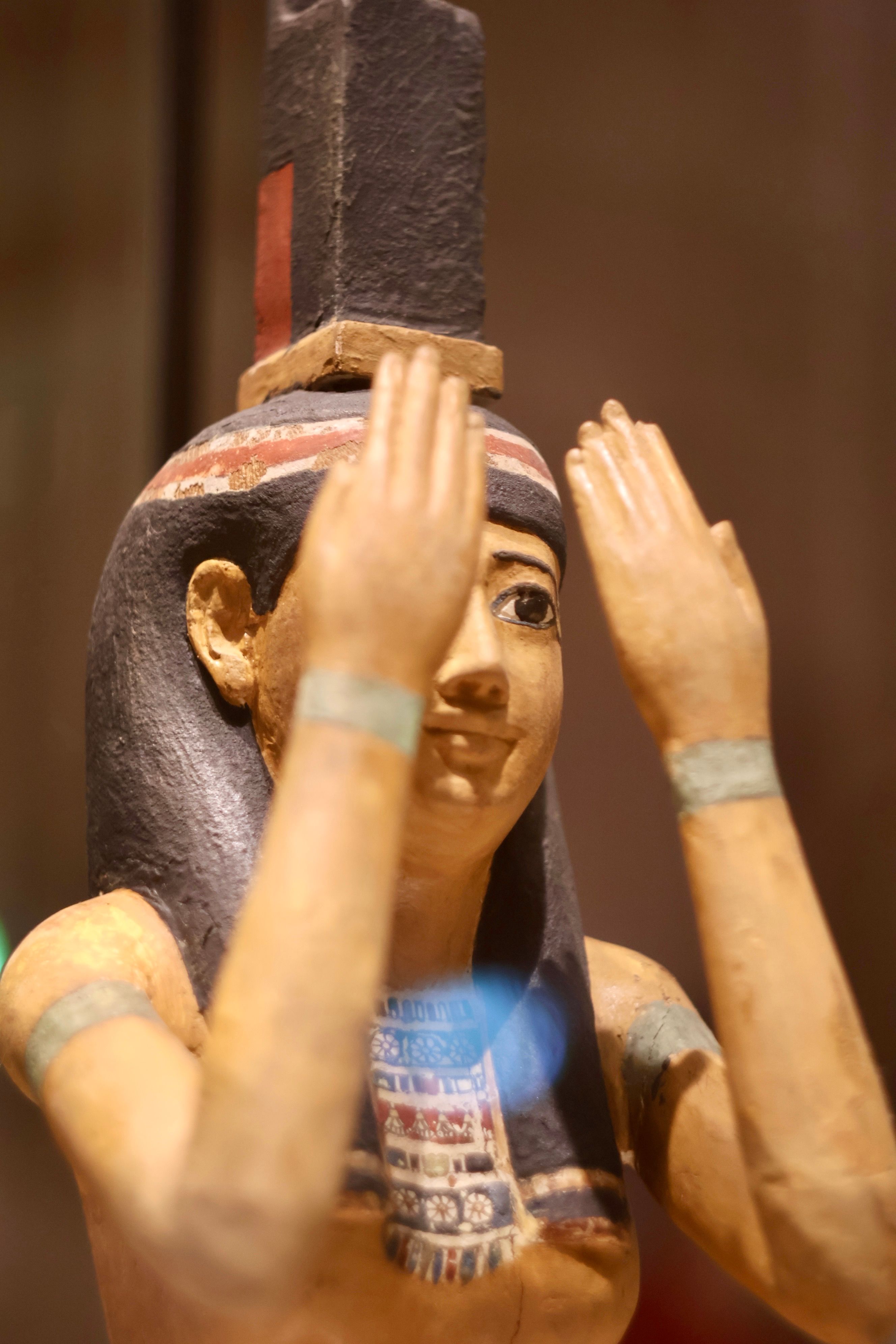 Close-up of a Ptolemaic statue of goddess Isis at Louvre, Paris.
