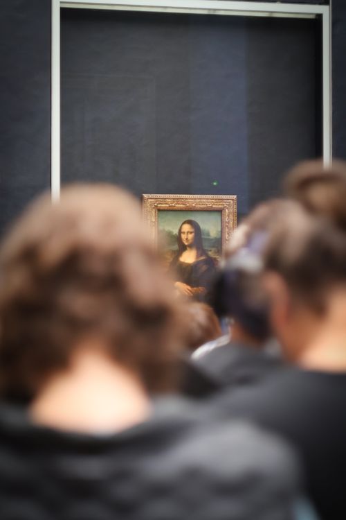 Free Tourists viewing the Mona Lisa at the Louvre Museum in Paris, France. Stock Photo