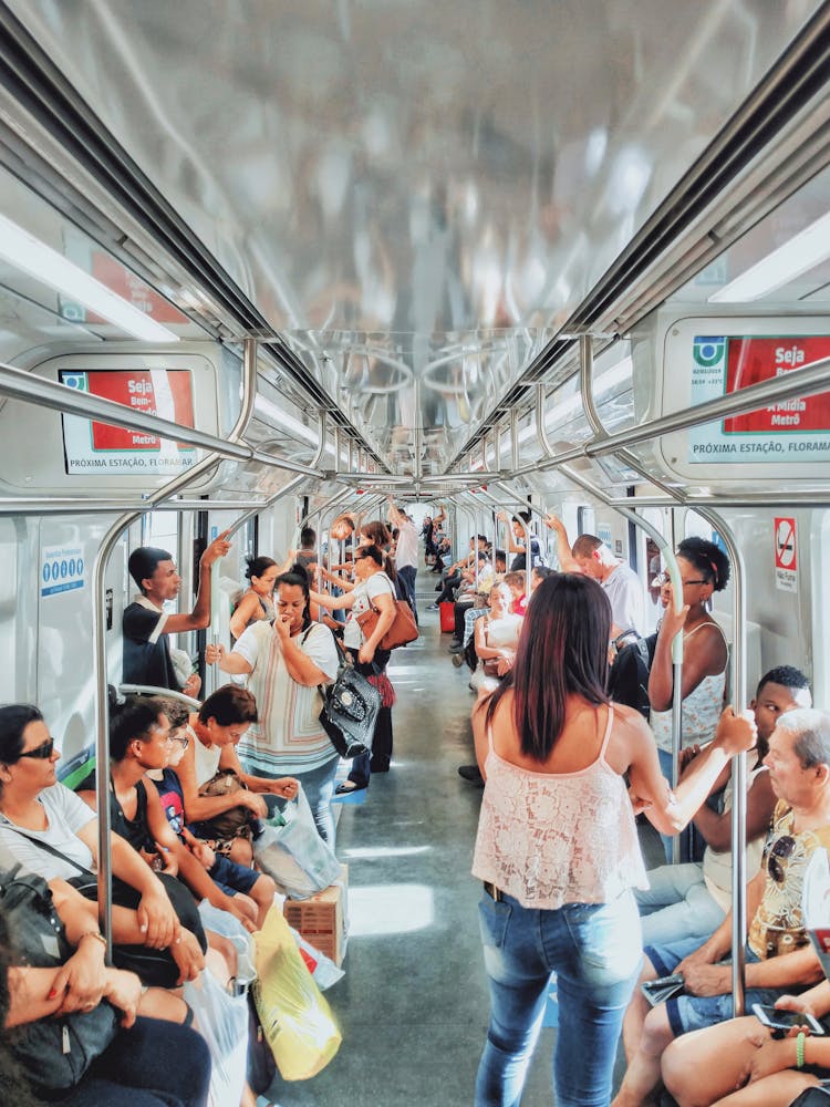 Group Of People Sitting Inside Train