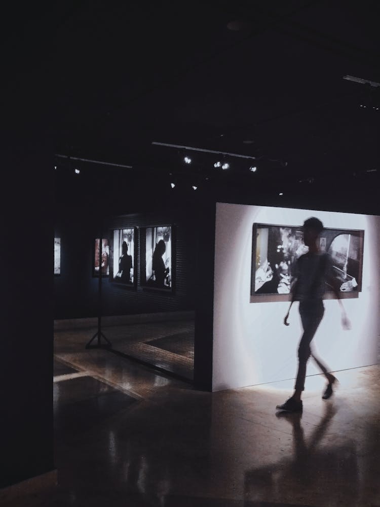 Silhouette Of Person On Dark Room