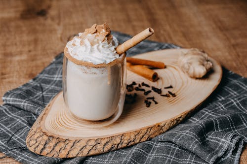 A cup of hot chocolate with cinnamon and whipped cream