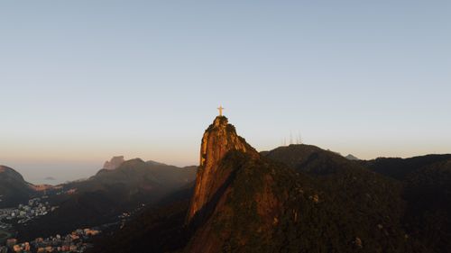Free Breathtaking aerial view of Christ the Redeemer statue and Rio's landscape at sunset. Stock Photo
