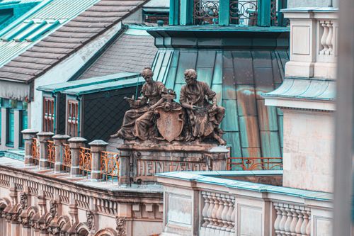 Free Detailed view of ornate rooftop sculptures and architecture in Hamburg, Germany. Stock Photo