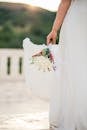 A bride holding a bouquet in her hand