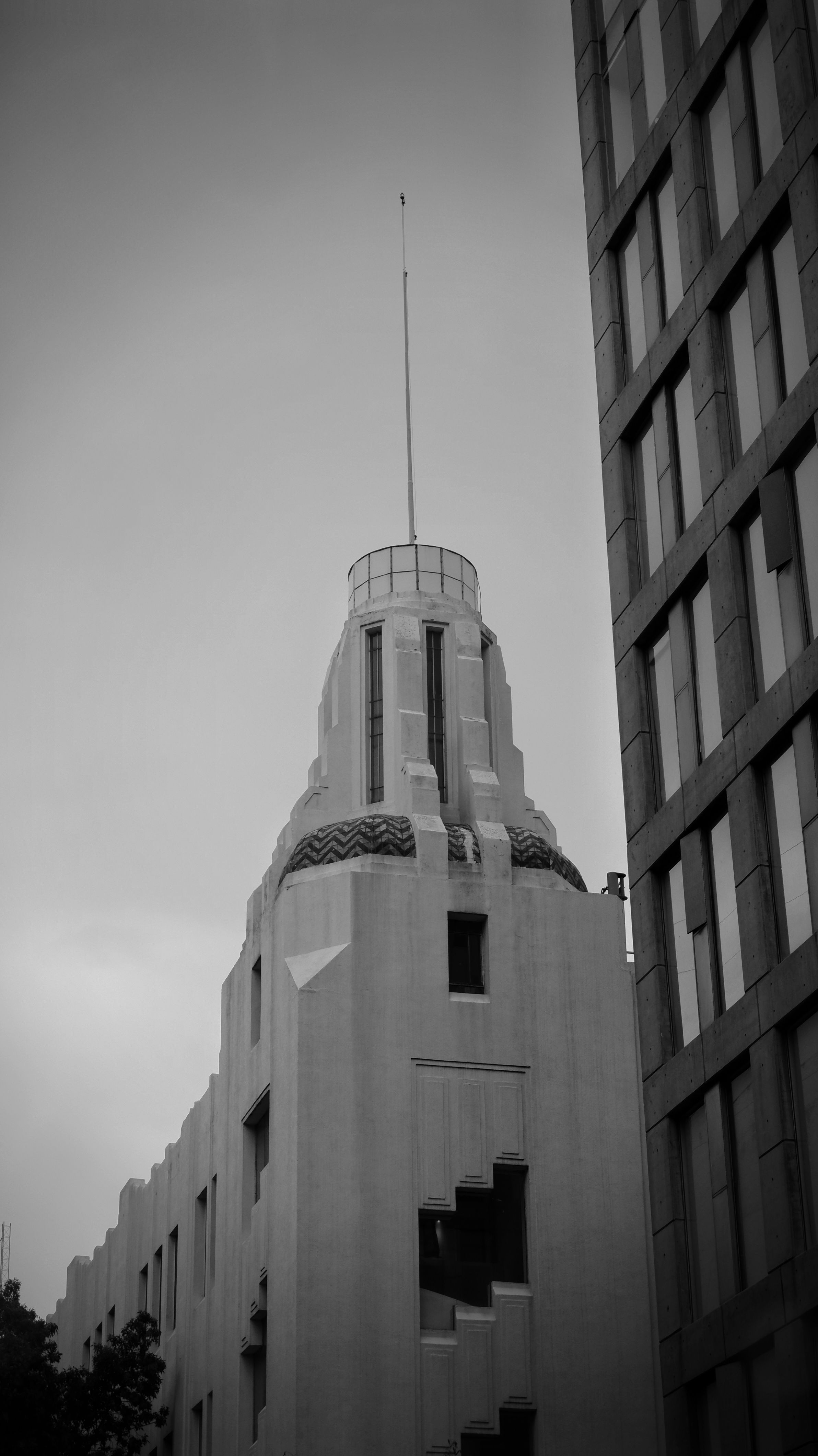 Black and white photograph of an Art Deco building in Mexico City, showcasing urban architecture.. pexels, black, white