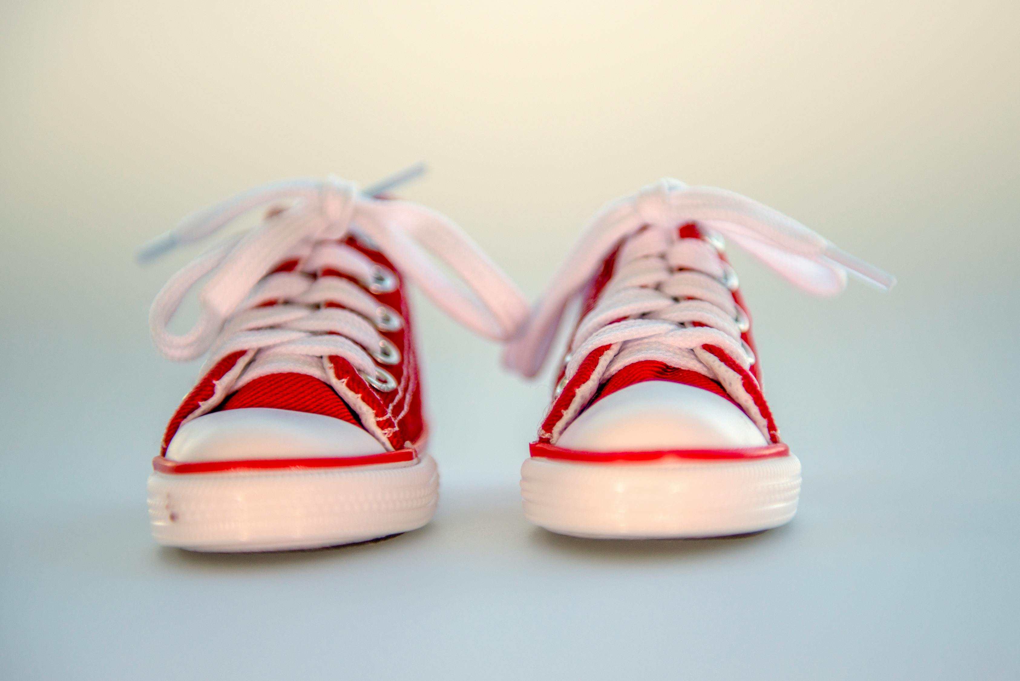 Close-up Photo of Pair of Red Low-top Baby Sneakers · Free Stock Photo