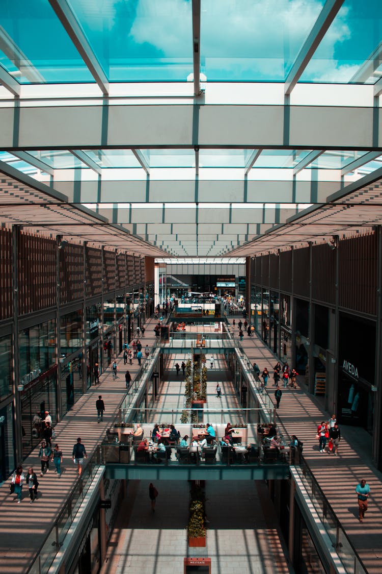 Group Of People Walking Inside Building