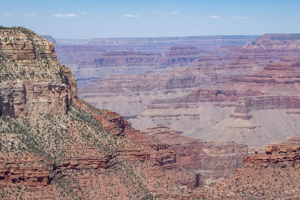 Layered rock formations and expansive views of the Grand Canyon