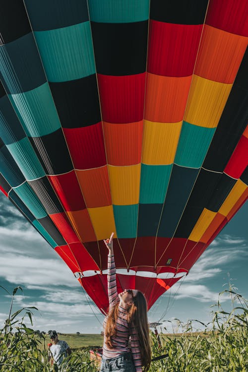 Woman Standing Near Hot Air Balloon