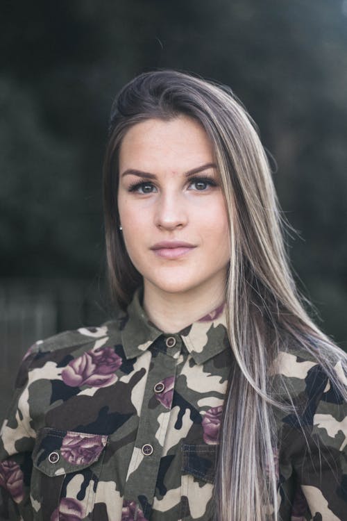 Portrait Photo of Woman in Green Floral Camouflage Shirt