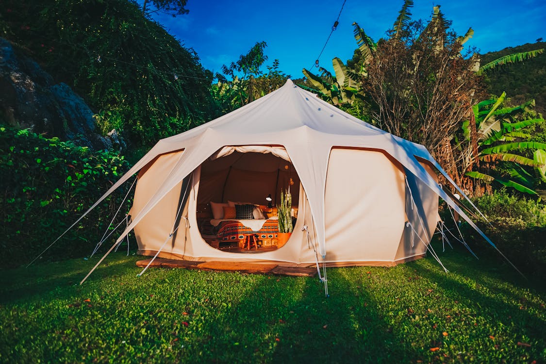 Free Camping Tent on Grass Lawn Stock Photo