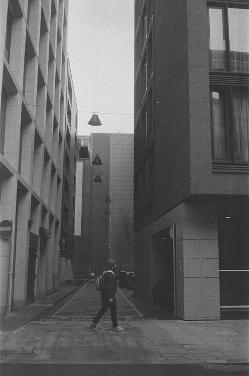 A man walking down a street in a city