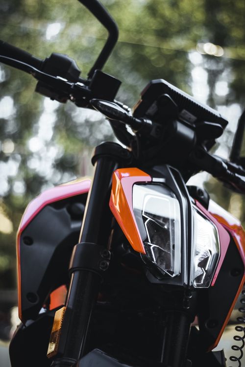 Free Detailed view of a motorcycle headlight showcasing modern design and technology. Stock Photo