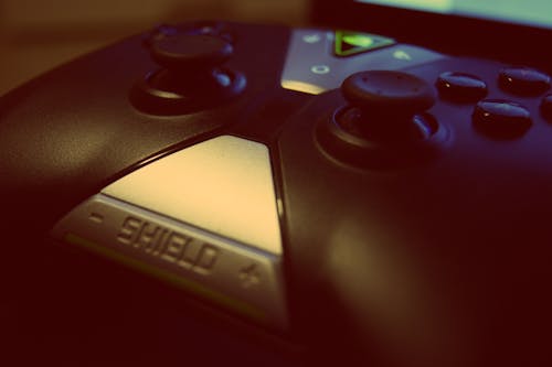 Black Shield Game Controller Close-up Photography