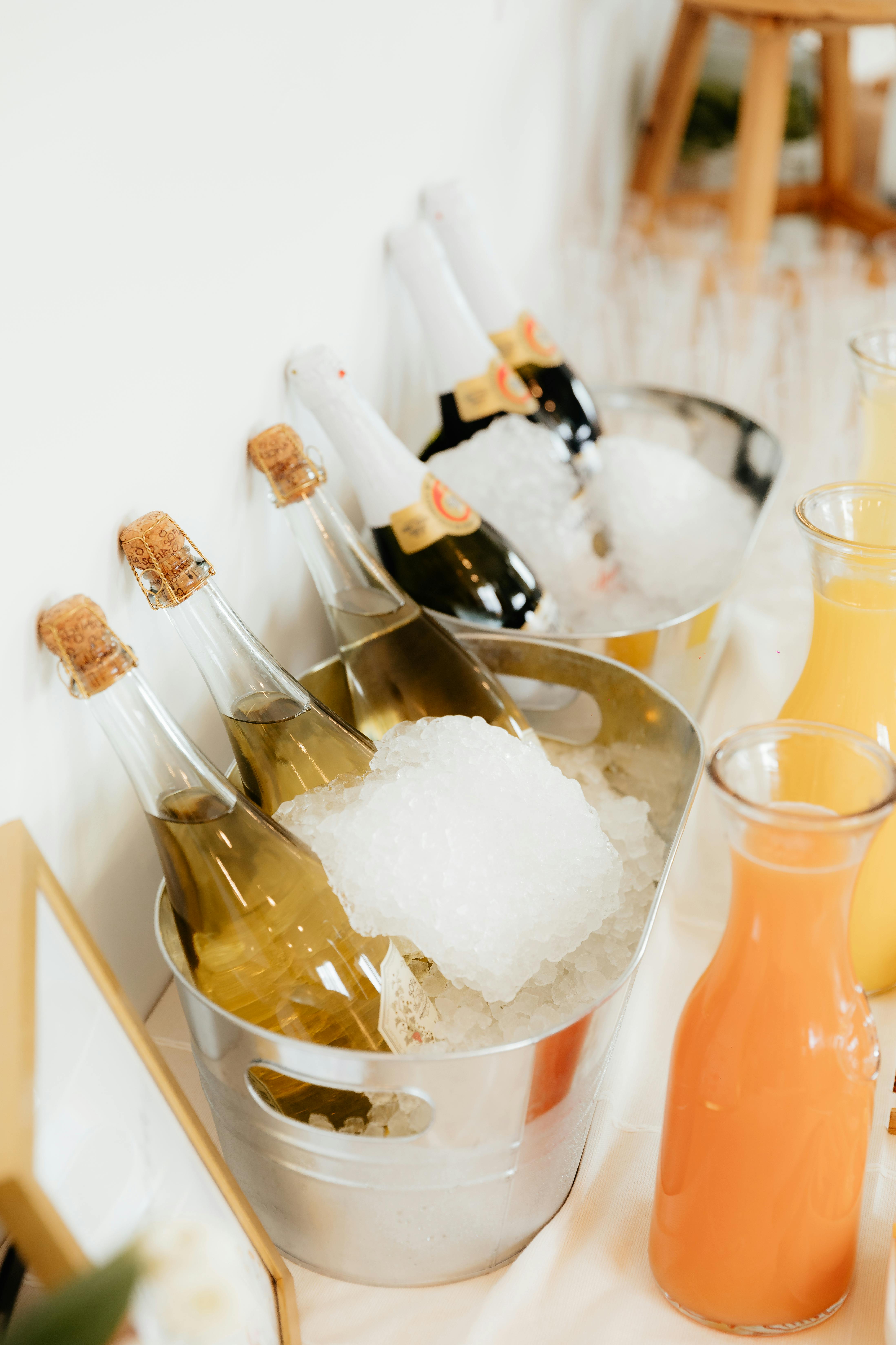 Cooling Champagne in Buckets with Ice · Free Stock Photo