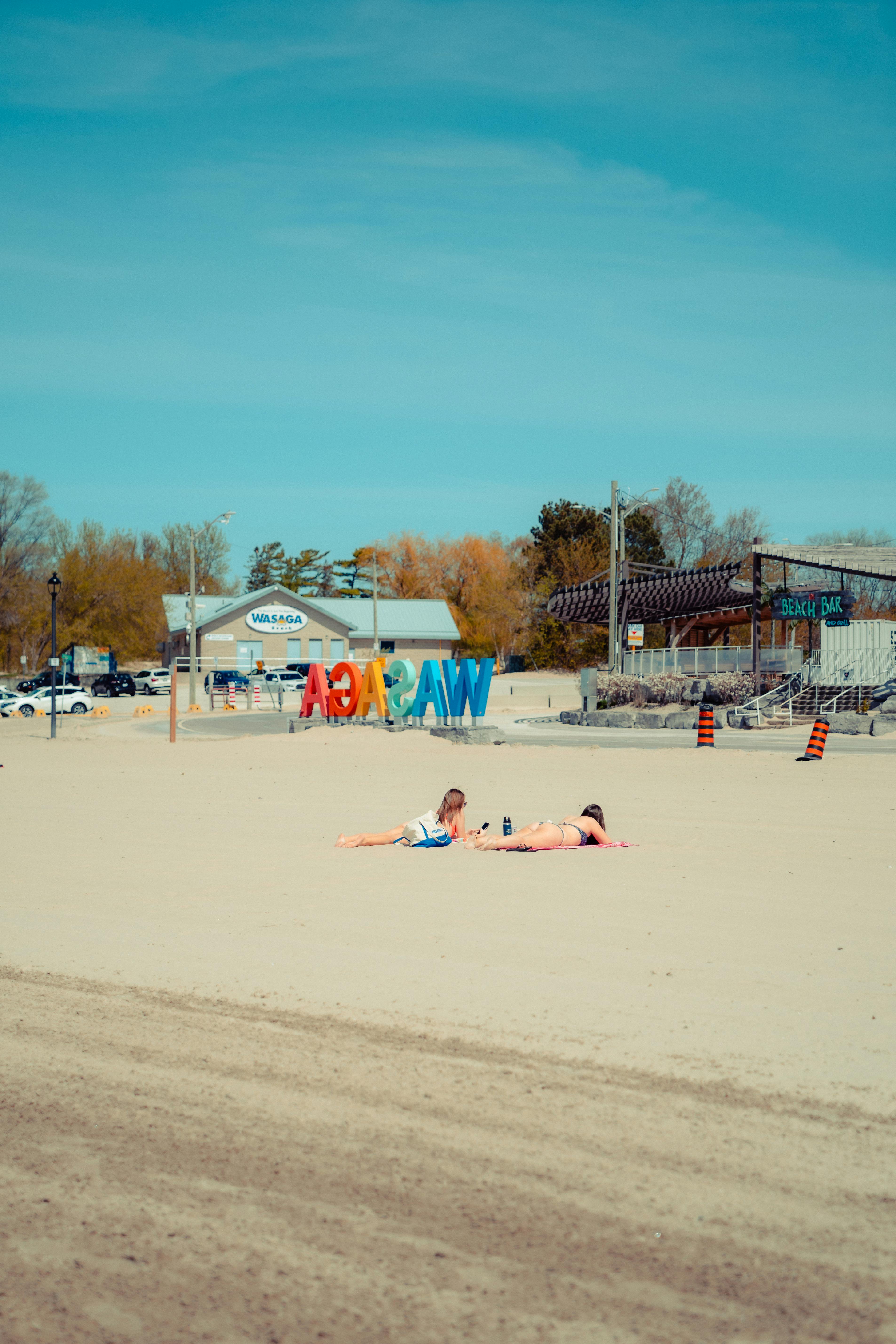 Legs of Woman on Beach Towel · Free Stock Photo