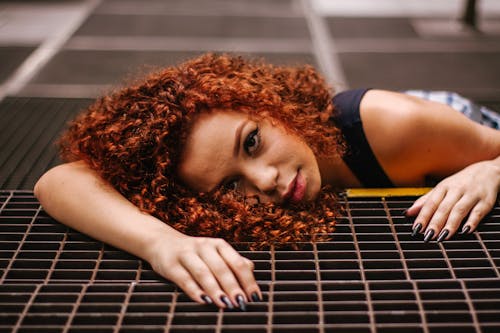Free Woman Lying on Black Rubber Mat Stock Photo