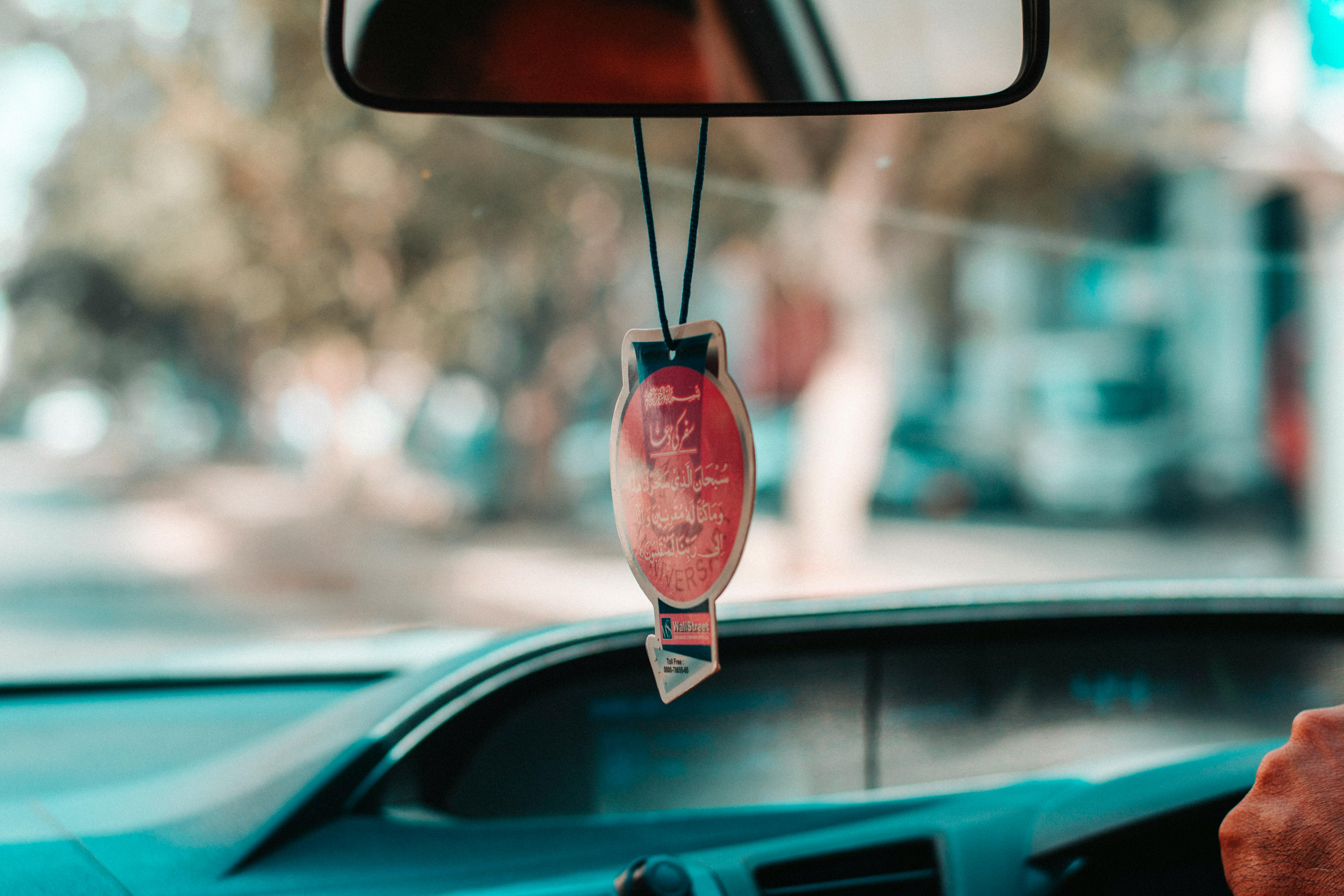 Red And Black Hanging Car Decor Free Stock Photo