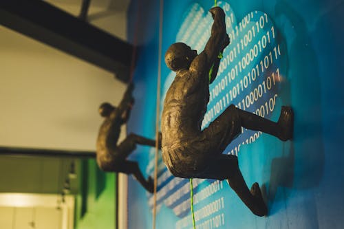 Man Climbing on Wall