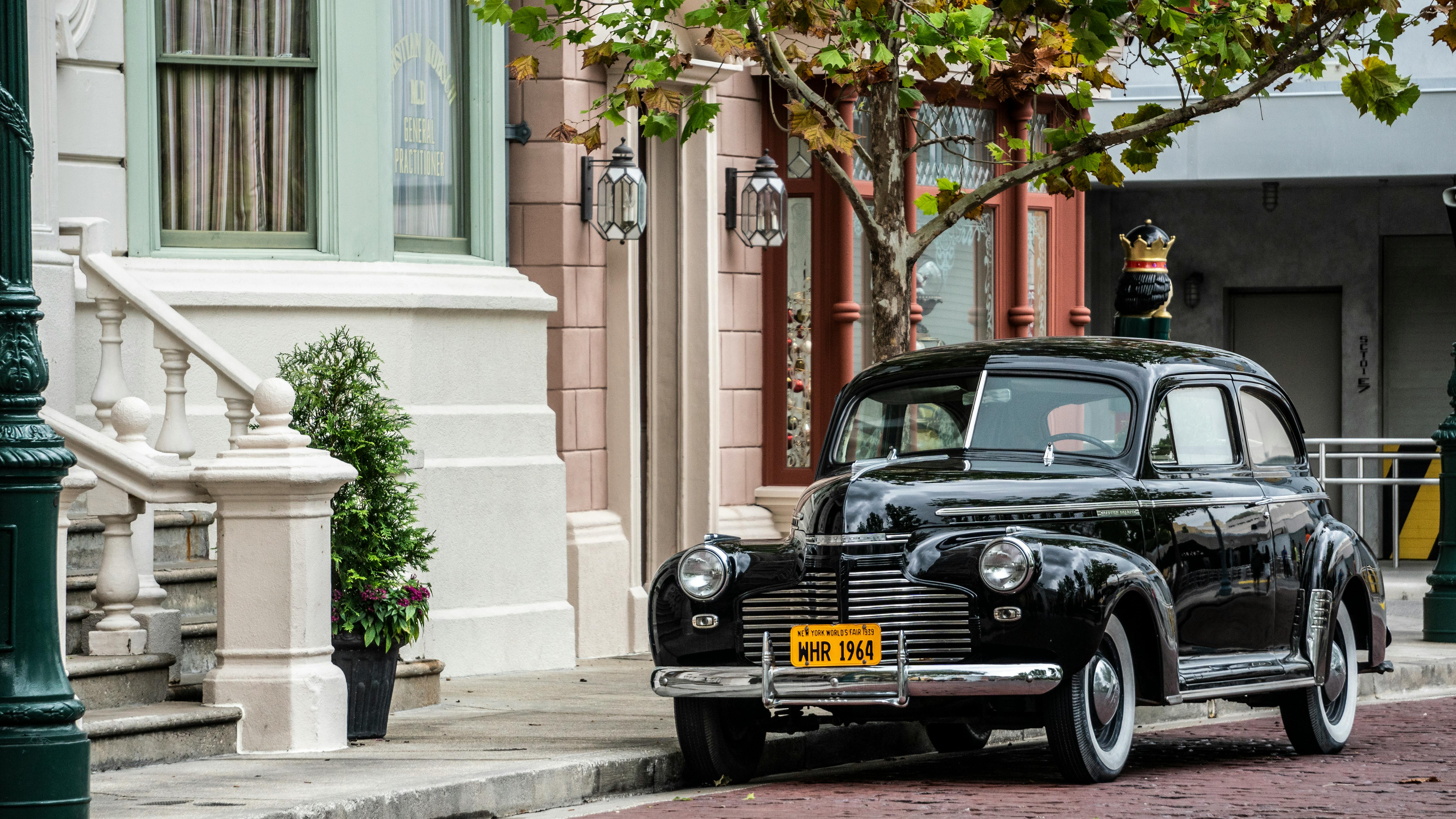 Vintage Black Car Parked Besides White House Free Stock Photo