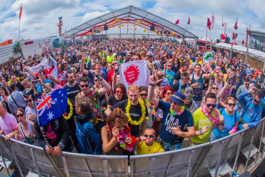 Lively outdoor crowd enjoying a summer music festival at Bloemendaal aan Zee, Netherlands.