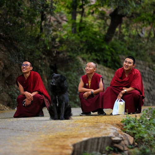 Three Monks Sitting On Road