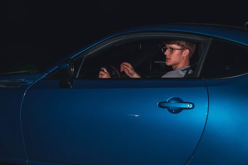 Free Man In Blue Coupe Stock Photo