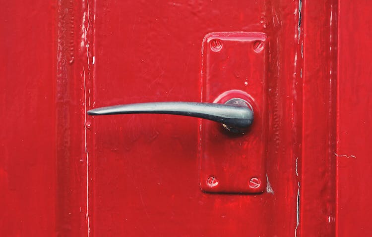 Metal Door Handle On A Red Door