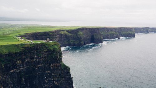 Free A breathtaking aerial view of the Cliffs of Moher along Ireland's rugged coastline. Stock Photo