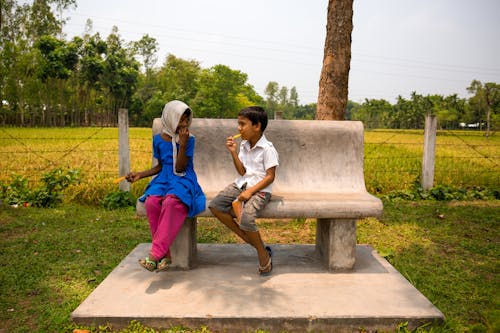 Children Sitting on Bench