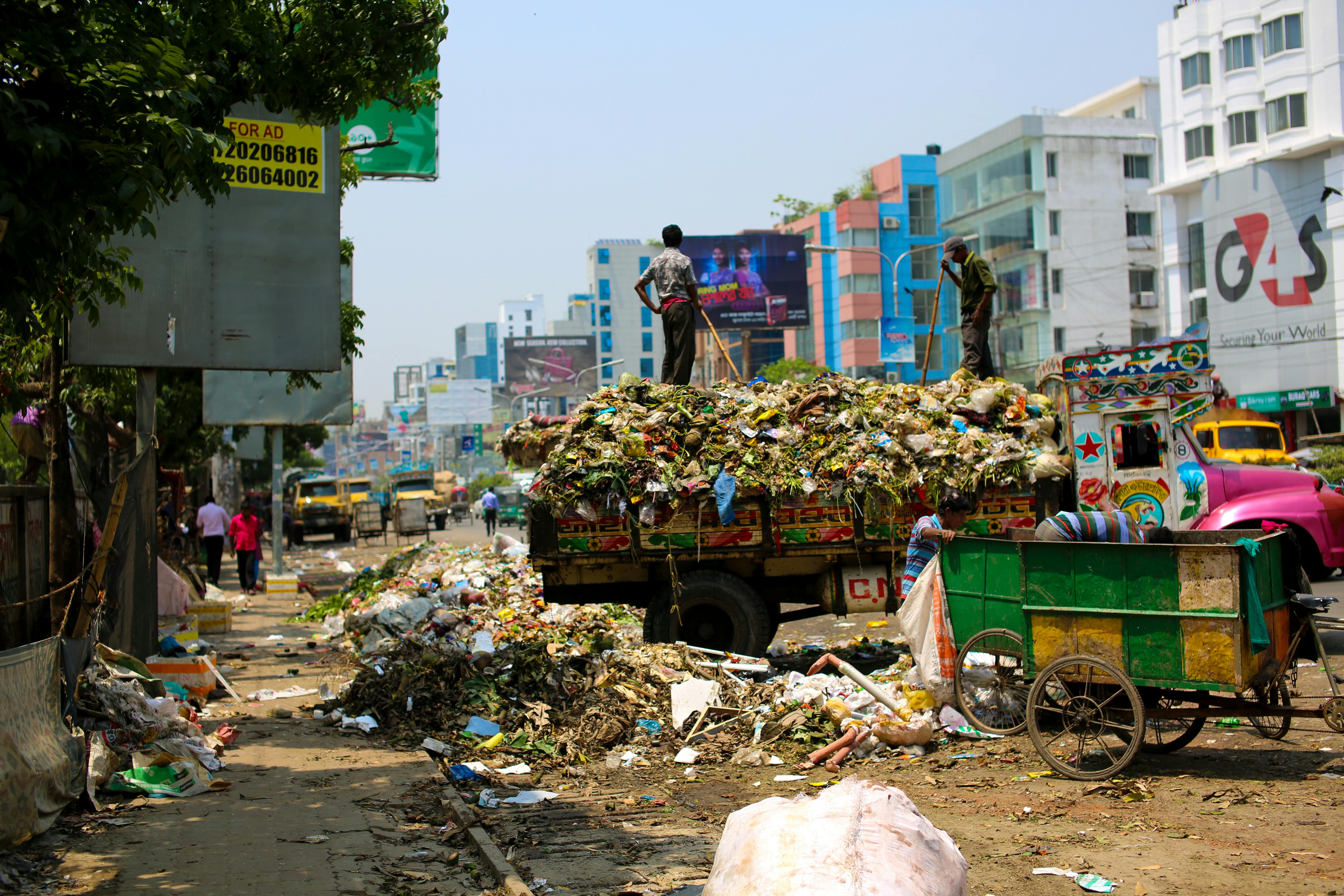 photo-of-a-dump-truck-across-buildings-free-stock-photo