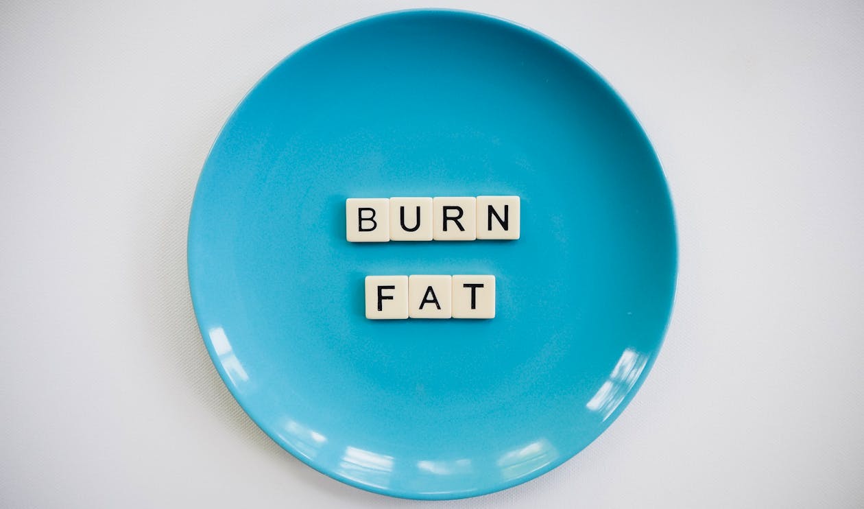 Burn Fat Text on Round Blue Plate