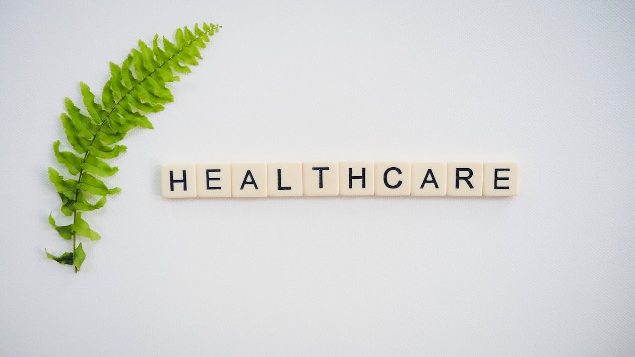 Free Healthcare Text Screenshot Near Green Fern Leaf Stock Photo