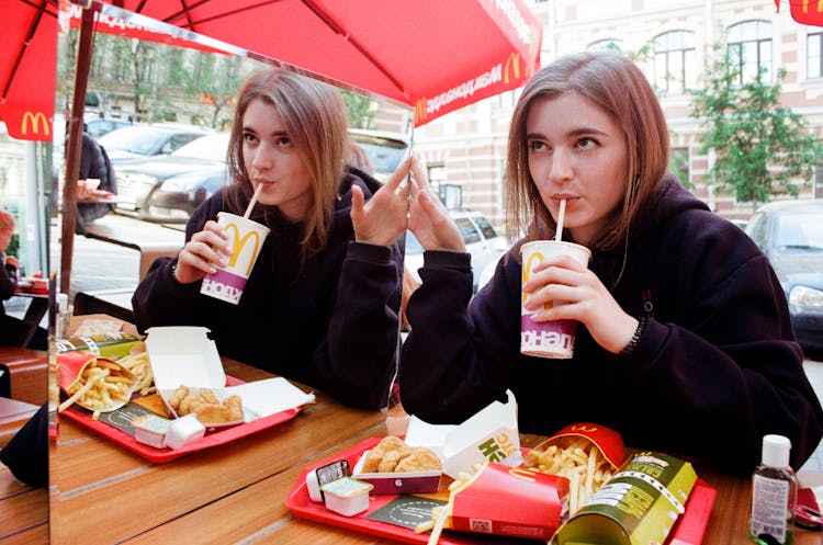 Photo Of A Woman Eating On McDonald's