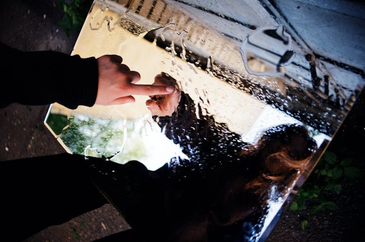 Person Touching Wet Mirror