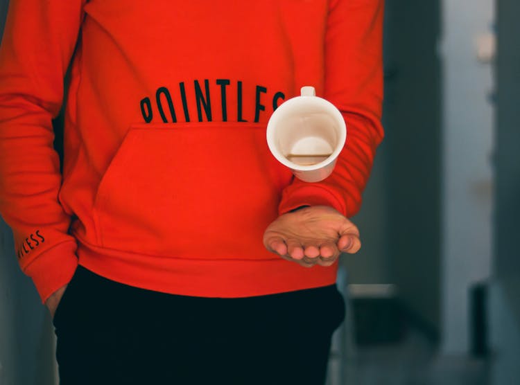 Person Catching White Mug