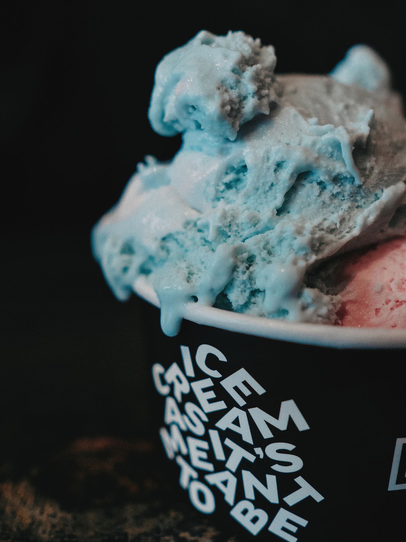 Cold dairy dessert in a paper cup illustrating the need to verify a paperboard package barrier and seal