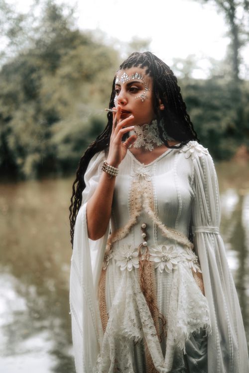 Pretty Woman in White Dress Smoking Cigarette · Free Stock Photo