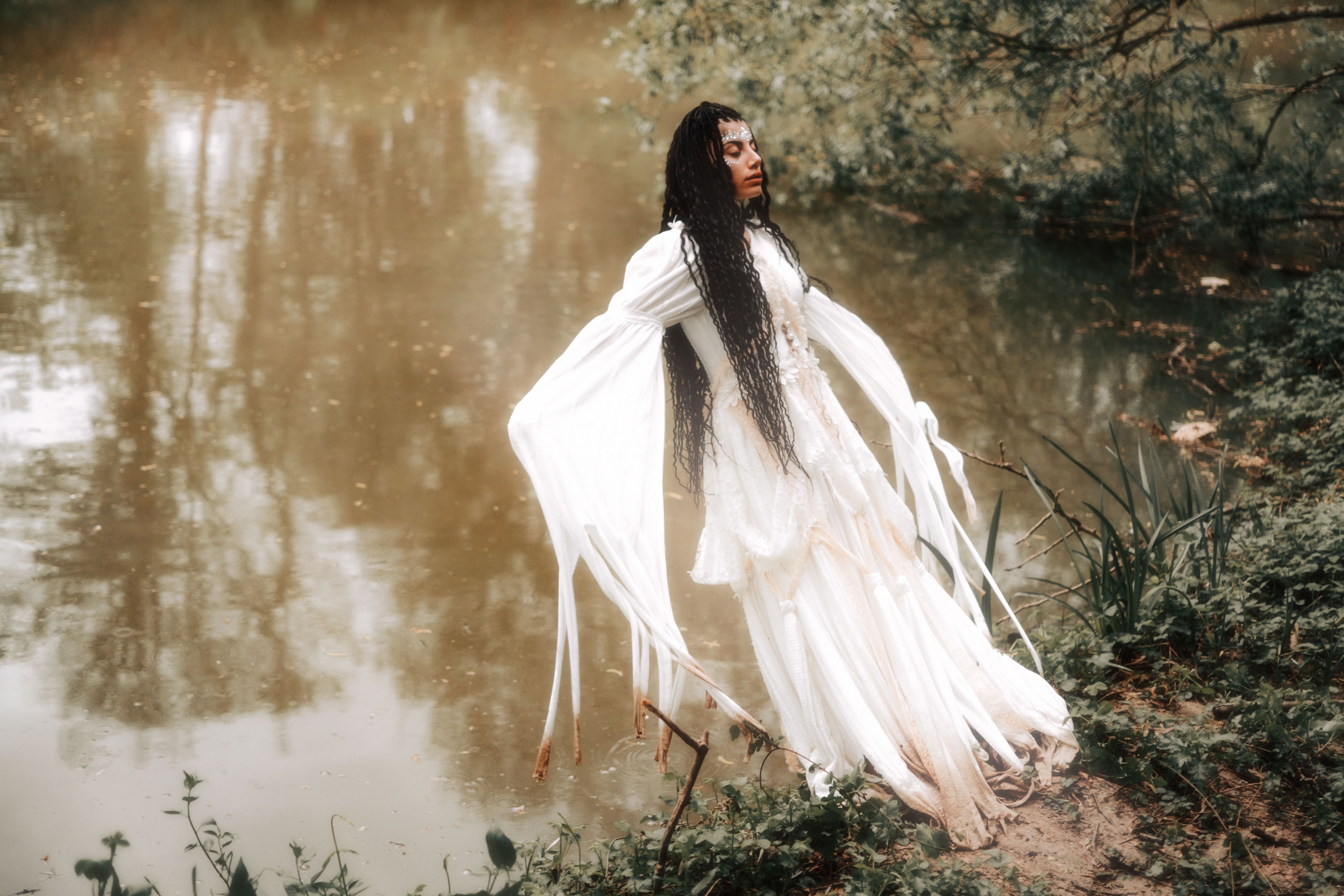 A woman in white dress standing in water · Free Stock Photo