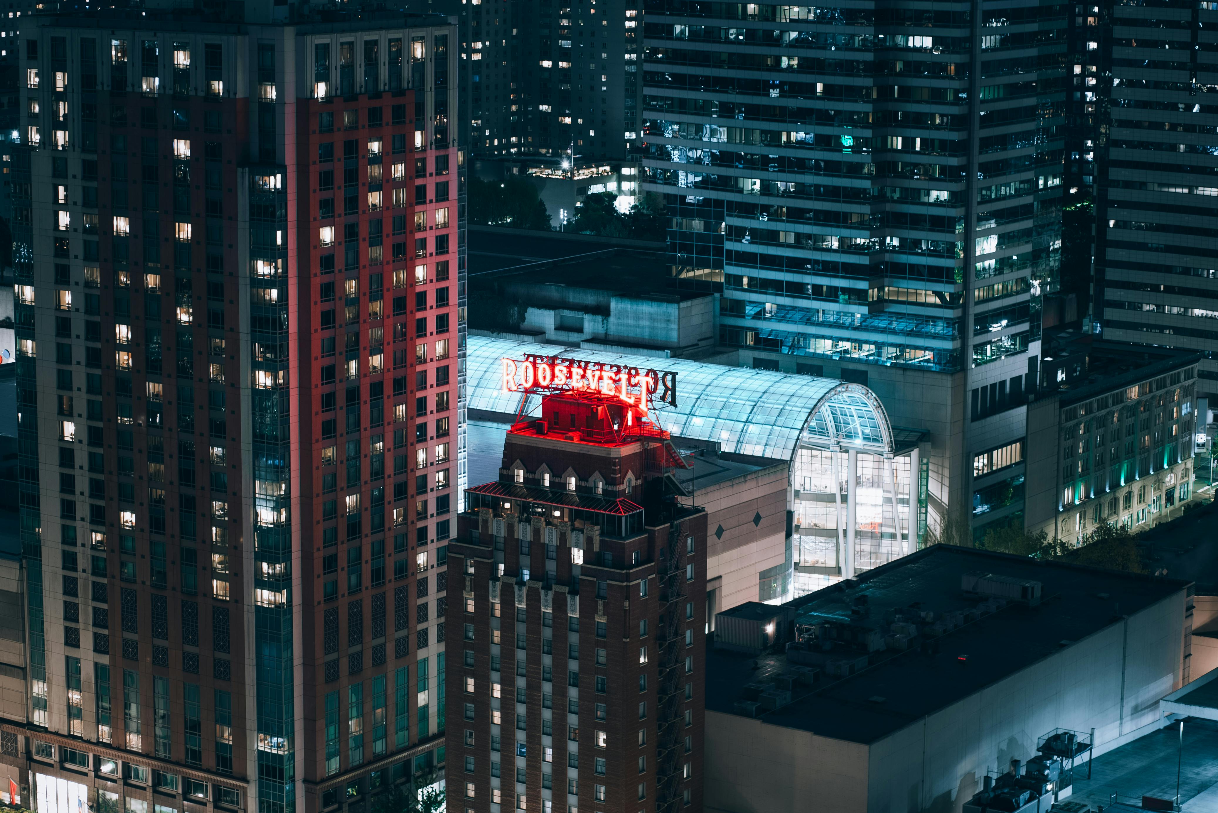 A stunning night view of Seattle's downtown skyline featuring the Roosevelt Hotel.