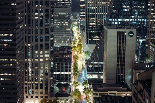 A vibrant nighttime view of Seattle's downtown skyline featuring illuminated skyscrapers.