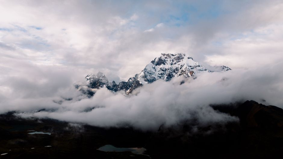 Best Full Day Group Shore Excursions Tours from Salaverry Port Review: Your Complete Guide to Peru's Ancient Wonders Review 2026 - Breathtaking view of snowcapped Andes mountains peeking through clouds in Cusco, Peru.